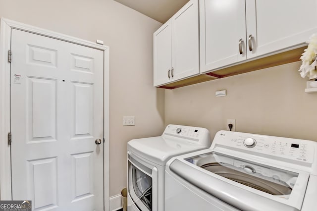 2325 Lake Cove Ct, Buford, GA 30519 - laundry room with washer and clothes dryer and cabinet space