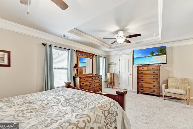 2325 Lake Cove Ct, Buford, GA 30519 - bedroom with ornamental molding, a tray ceiling, carpet flooring, and a ceiling fan