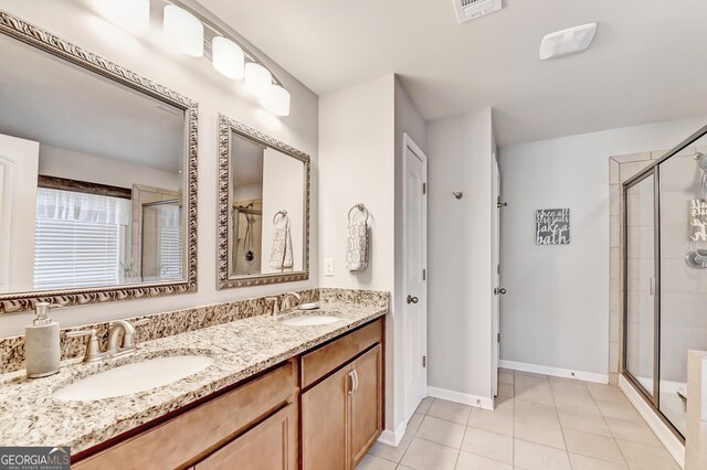 2325 Lake Cove Ct, Buford, GA 30519 - full bathroom with a stall shower, tile patterned floors, and double vanity