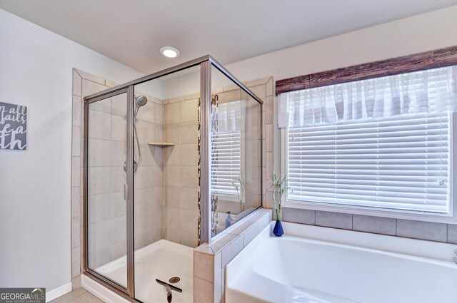 2325 Lake Cove Ct, Buford, GA 30519 - bathroom featuring a bath and a shower stall