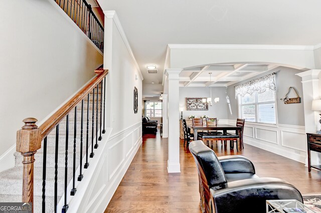 2325 Lake Cove Ct, Buford, GA 30519 - dining room with ornate columns, plenty of natural light, wood finished floors, a decorative wall, and coffered ceiling