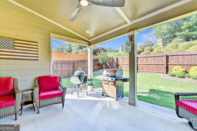 2325 Lake Cove Ct, Buford, GA 30519 - fenced backyard featuring grilling area, ceiling fan, and a patio area
