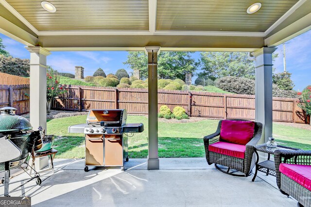 2325 Lake Cove Ct, Buford, GA 30519 - fenced backyard with a grill and a patio area