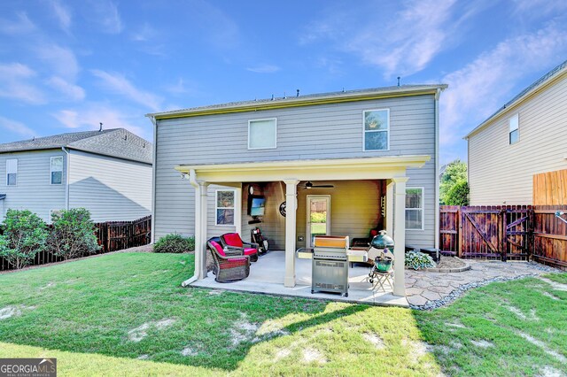 2325 Lake Cove Ct, Buford, GA 30519 - rear view of property with a fenced backyard, a patio, and a ceiling fan