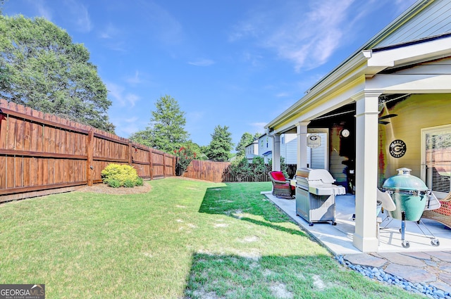 2325 Lake Cove Ct, Buford, GA 30519 - fenced backyard featuring a patio area