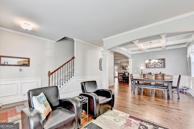 2325 Lake Cove Ct, Buford, GA 30519 - living room with ornate columns, arched walkways, coffered ceiling, a chandelier, and wood finished floors