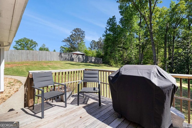 15 Cedar Ln E, Newnan, GA 30263 - wooden deck with area for grilling and a fenced backyard