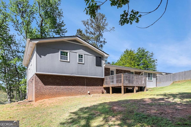15 Cedar Ln E, Newnan, GA 30263 - rear view of house with brick siding and a deck
