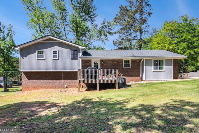15 Cedar Ln E, Newnan, GA 30263 - back of house featuring brick siding, a wooden deck, and a yard