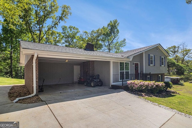 15 Cedar Ln E, Newnan, GA 30263 - view of front of house with concrete driveway, a front lawn, brick siding, and a chimney