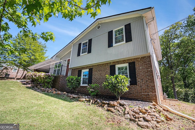 15 Cedar Ln E, Newnan, GA 30263 - view of home's exterior with brick siding and a lawn