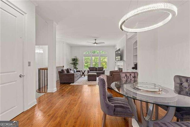 4089 Thorndale Ln Unit 13, Smyrna, GA 30080 - dining room with wood finished floors, a ceiling fan, and a chandelier