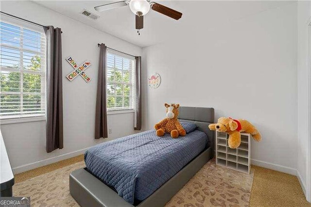 4089 Thorndale Ln Unit 13, Smyrna, GA 30080 - carpeted bedroom featuring baseboards and ceiling fan