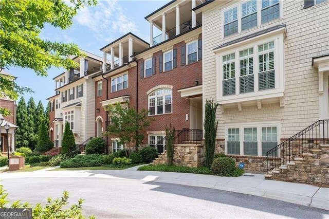 4089 Thorndale Ln Unit 13, Smyrna, GA 30080 - view of building exterior featuring stairway