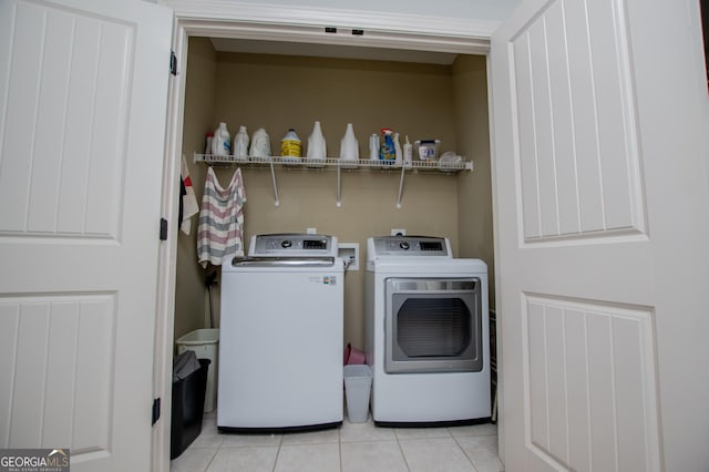 304 Wooded Glen Ln, Carrollton, GA 30117 - laundry room with washing machine and clothes dryer and light tile patterned floors