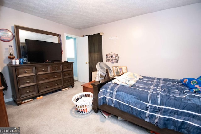 128 Robinhood Dr, Newnan, GA 30263 - bedroom with a textured ceiling and carpet flooring