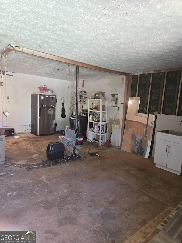 8778 Homewood Ct, Riverdale, GA 30274 - garage with freestanding refrigerator and a sink
