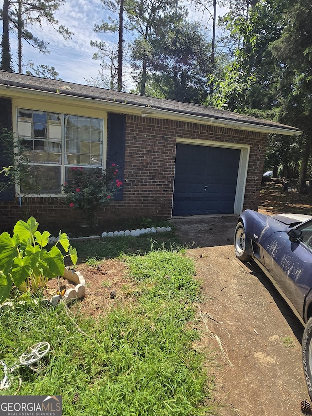 8778 Homewood Ct, Riverdale, GA 30274 - ranch-style home with brick siding, driveway, and a garage