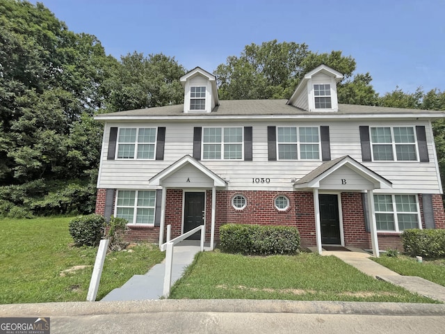 1050 Wheel House Ln Unit A, Monroe, GA 30655 - townhome / multi-family property with brick siding and a front lawn