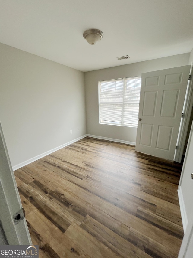 1050 Wheel House Ln Unit A, Monroe, GA 30655 - unfurnished room featuring wood finished floors and baseboards