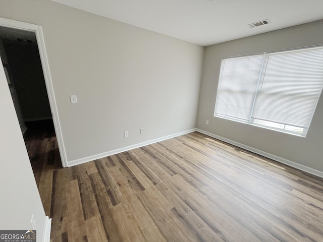 1050 Wheel House Ln Unit A, Monroe, GA 30655 - spare room featuring wood finished floors