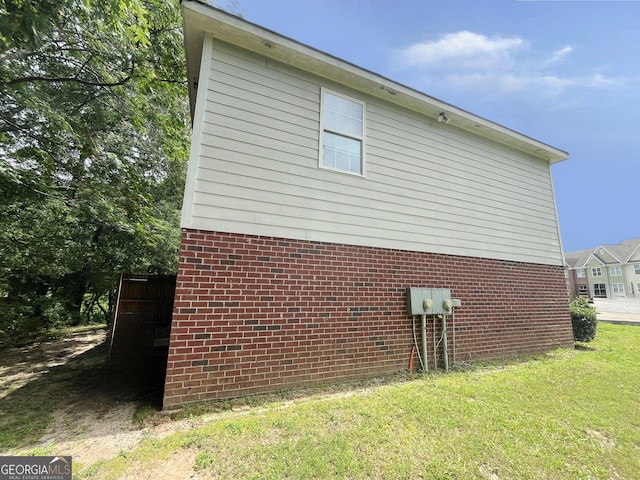 1050 Wheel House Ln Unit A, Monroe, GA 30655 - view of home's exterior with a lawn and brick siding