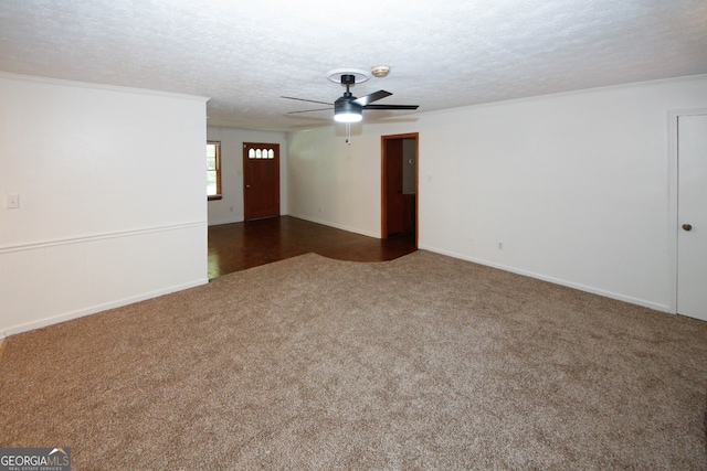 2202 Springdale Dr, Snellville, GA 30078 - empty room with carpet, a textured ceiling, a ceiling fan, crown molding, and a smoke detector