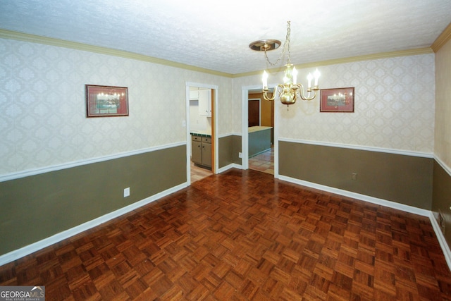 2202 Springdale Dr, Snellville, GA 30078 - unfurnished room featuring a chandelier, ornamental molding, wainscoting, and a textured ceiling