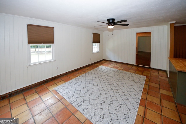 2202 Springdale Dr, Snellville, GA 30078 - tiled spare room featuring a ceiling fan and baseboards