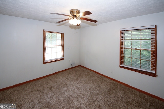 2202 Springdale Dr, Snellville, GA 30078 - carpeted empty room with a ceiling fan and baseboards