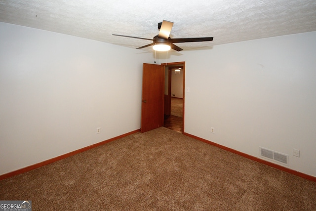2202 Springdale Dr, Snellville, GA 30078 - carpeted empty room featuring a ceiling fan and a textured ceiling
