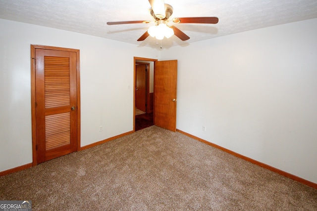2202 Springdale Dr, Snellville, GA 30078 - unfurnished bedroom with carpet, a closet, and ceiling fan