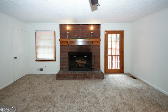2202 Springdale Dr, Snellville, GA 30078 - unfurnished living room featuring carpet flooring, healthy amount of natural light, crown molding, and a brick fireplace