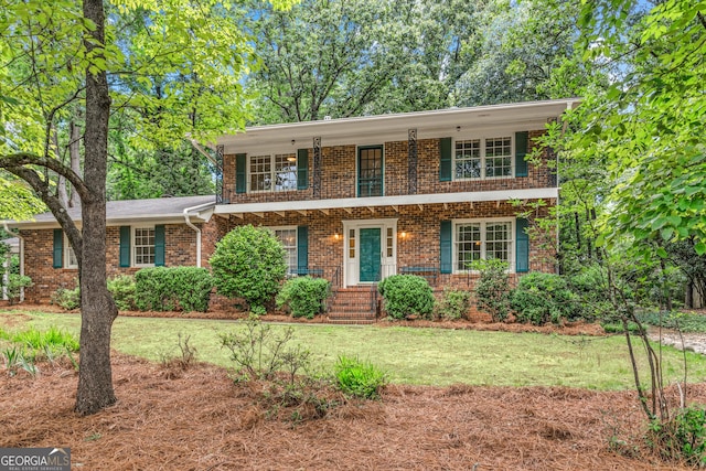 175 Cedar Creek Dr, Athens, GA 30605 - view of front of property with brick siding, a front lawn, a balcony, and a porch