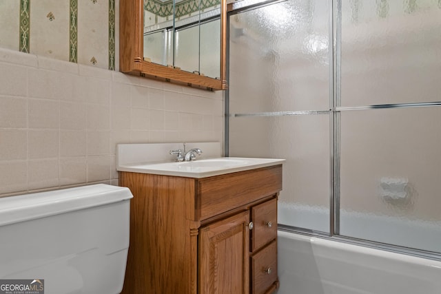 175 Cedar Creek Dr, Athens, GA 30605 - full bathroom featuring vanity, enclosed tub / shower combo, and tile walls
