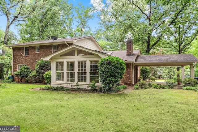 175 Cedar Creek Dr, Athens, GA 30605 - back of property with brick siding, a lawn, a chimney, and a carport
