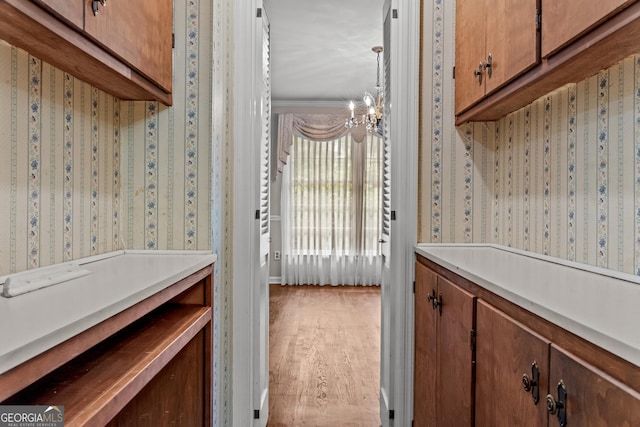 175 Cedar Creek Dr, Athens, GA 30605 - washroom with a chandelier, wood finished floors, and wallpapered walls