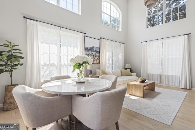 300 Brickworks Cir NE # 302, Atlanta, GA 30307 - dining space with a high ceiling and wood finished floors