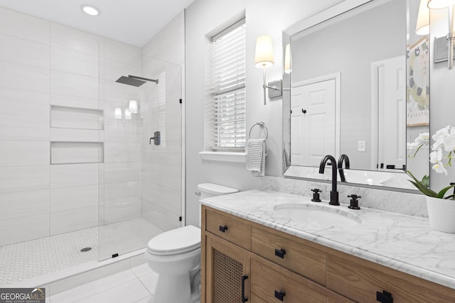 300 Brickworks Cir NE # 302, Atlanta, GA 30307 - bathroom featuring vanity, a tile shower, and tile patterned floors