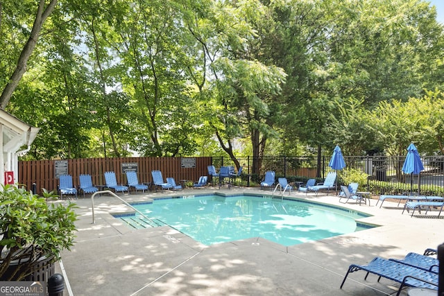 300 Brickworks Cir NE # 302, Atlanta, GA 30307 - community pool with a patio area and view of wooded area