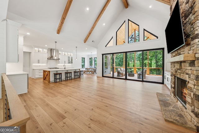 121 White Pen Rd, Talking Rock, GA 30175 - living area featuring a fireplace, high vaulted ceiling, beamed ceiling, recessed lighting, and light wood-style floors