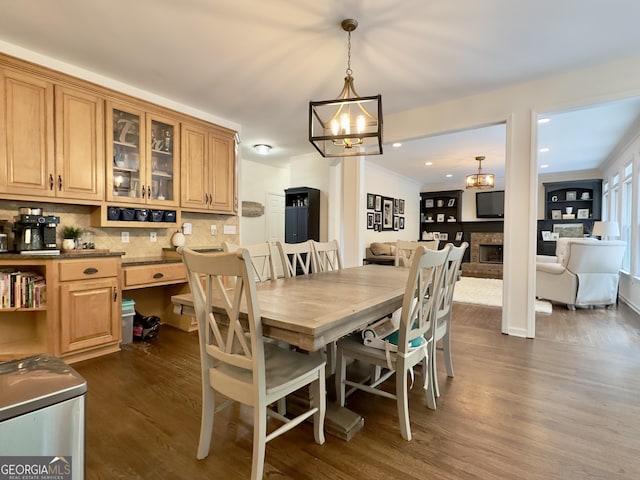 48 Red Bud Ln, Dallas, GA 30132 - dining area with dark wood-style flooring, a chandelier, crown molding, and recessed lighting