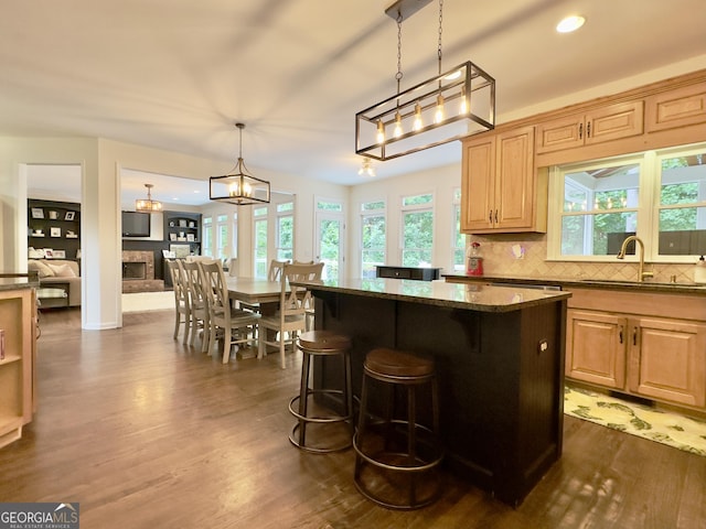 48 Red Bud Ln, Dallas, GA 30132 - kitchen featuring dark wood-style floors, plenty of natural light, dark stone countertops, and recessed lighting