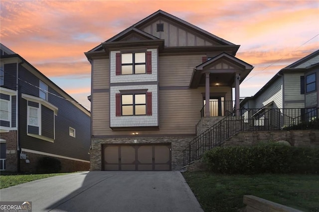 2108 Main St NW, Atlanta, GA 30318 - view of front of house with stairway, driveway, a garage, and board and batten siding