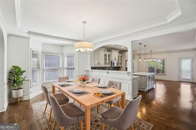2108 Main St NW, Atlanta, GA 30318 - dining room with a chandelier, dark wood-style floors, ornamental molding, arched walkways, and a tray ceiling