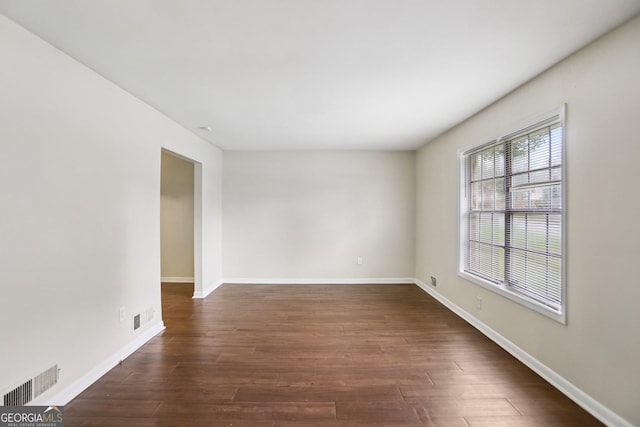 1517 Indian Forest Trl, Stone Mountain, GA 30083 - empty room with dark wood finished floors and baseboards