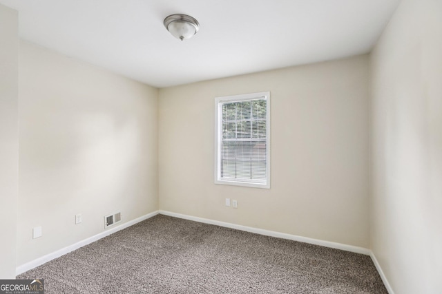 1517 Indian Forest Trl, Stone Mountain, GA 30083 - spare room with carpet and baseboards