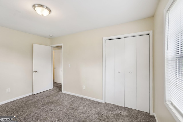 1517 Indian Forest Trl, Stone Mountain, GA 30083 - unfurnished bedroom featuring carpet flooring and a closet