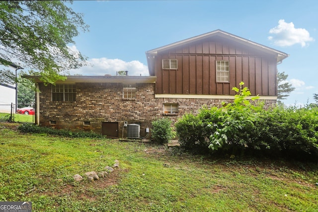 1517 Indian Forest Trl, Stone Mountain, GA 30083 - view of home's exterior featuring board and batten siding, crawl space, and brick siding