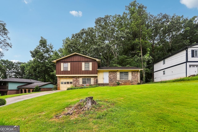 1517 Indian Forest Trl, Stone Mountain, GA 30083 - split level home featuring concrete driveway, a garage, a front lawn, board and batten siding, and brick siding